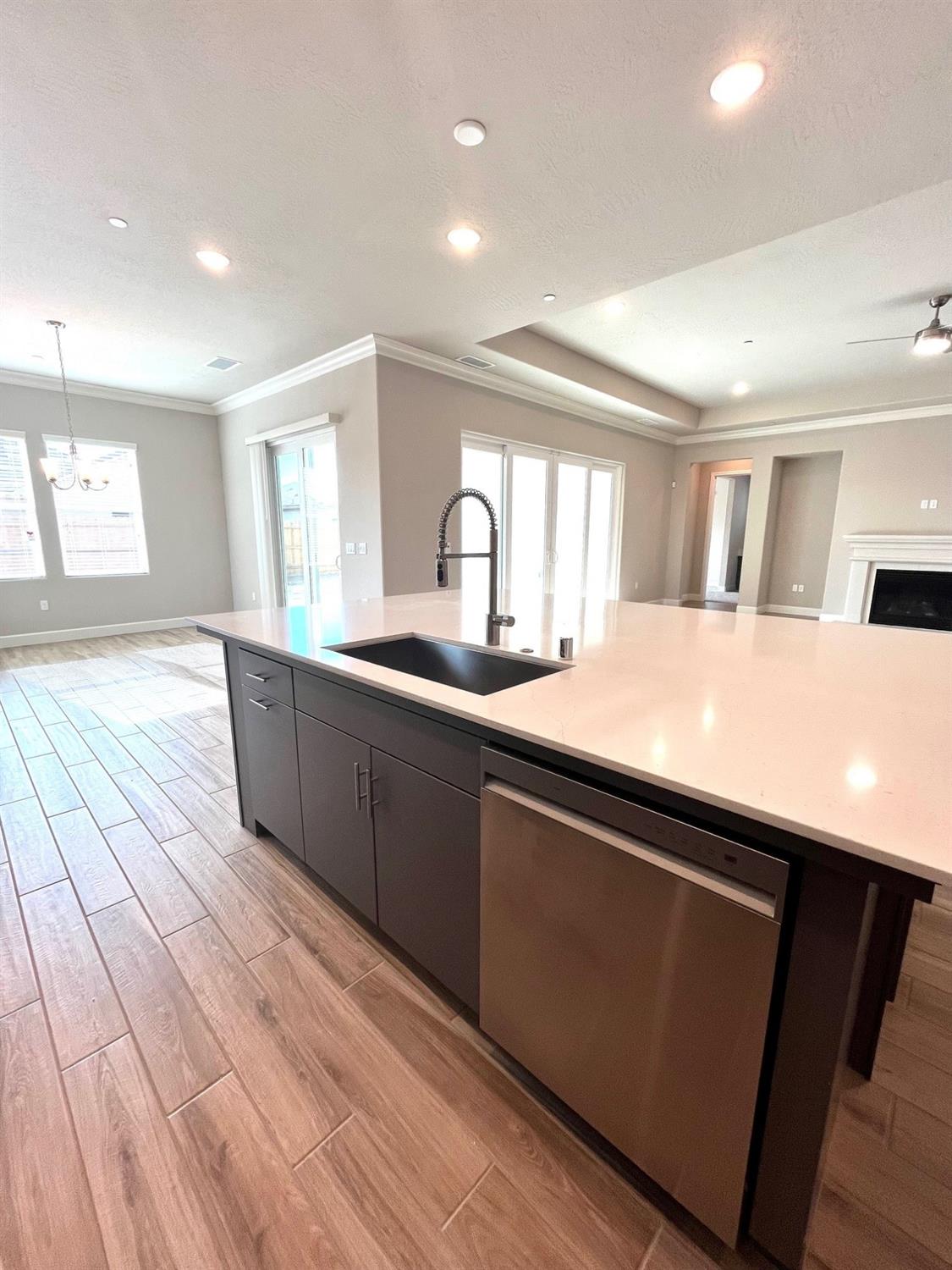 682 Bloom Lane Clovis, CA 93619 - Photo 10 of 30 a kitchen with stainless steel appliances granite countertop a sink and wooden floor