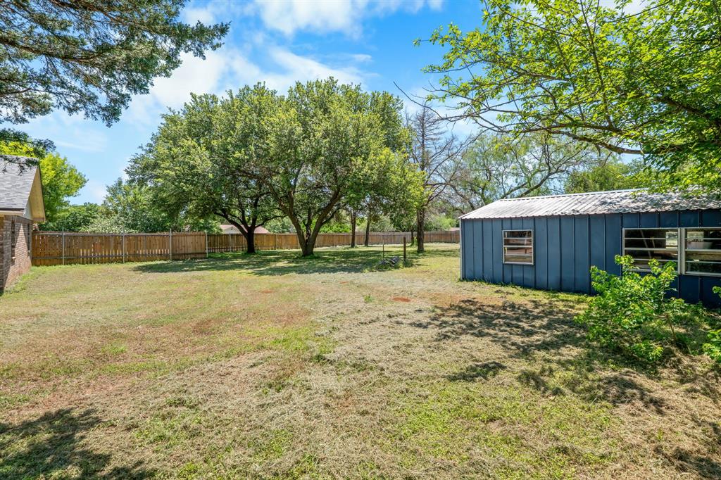 373 Ingred Street Waco, TX 76705 - Photo 30 of 39 a view of a backyard with large trees