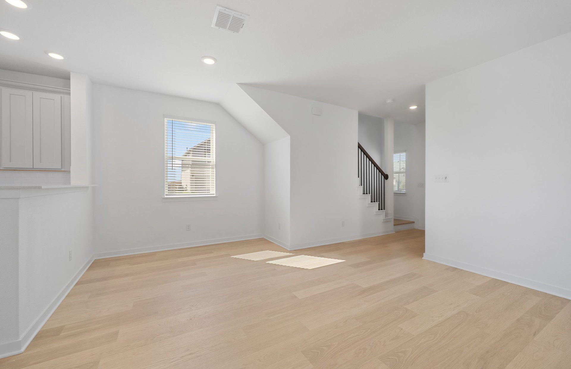 608 Rubber Tree Way Buda, TX 78610 - Photo 7 of 29 an empty room with windows