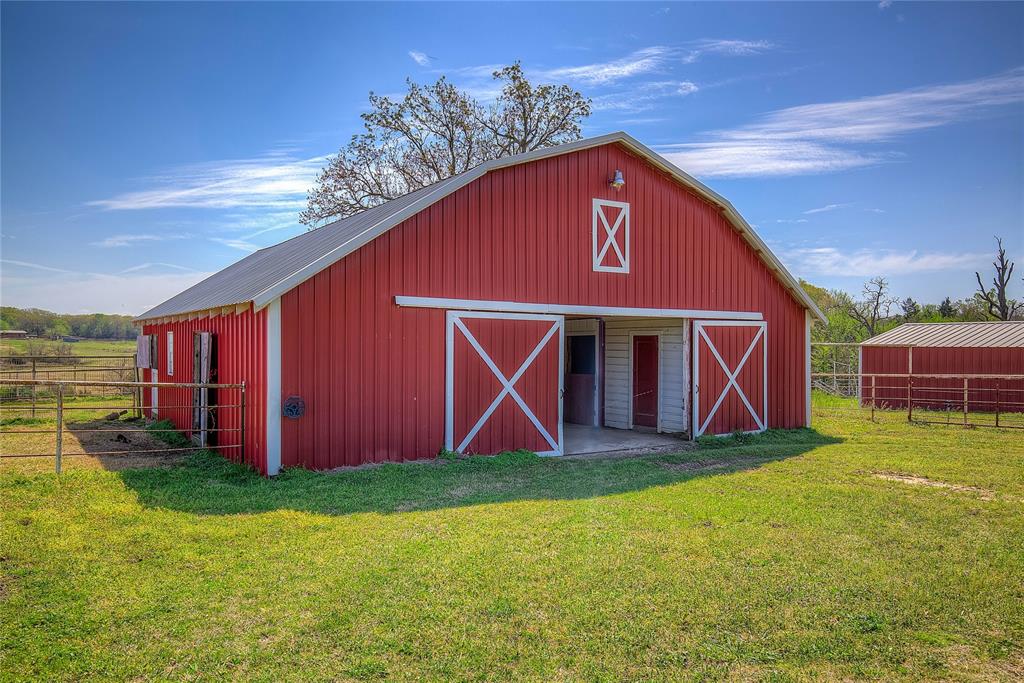 7359 Highway 154 Sulphur Springs, TX 75482 - Photo 6 of 40 1 of THREE horse barns on the property; 14 stalls total, plus tack rooms, stud pen, wash bay, hay storage and stocks