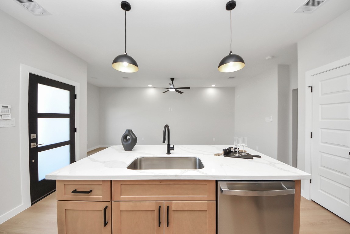 9826 Nedwald Street Houston, TX 77029 - Photo 11 of 50 a kitchen with a sink and dishwasher