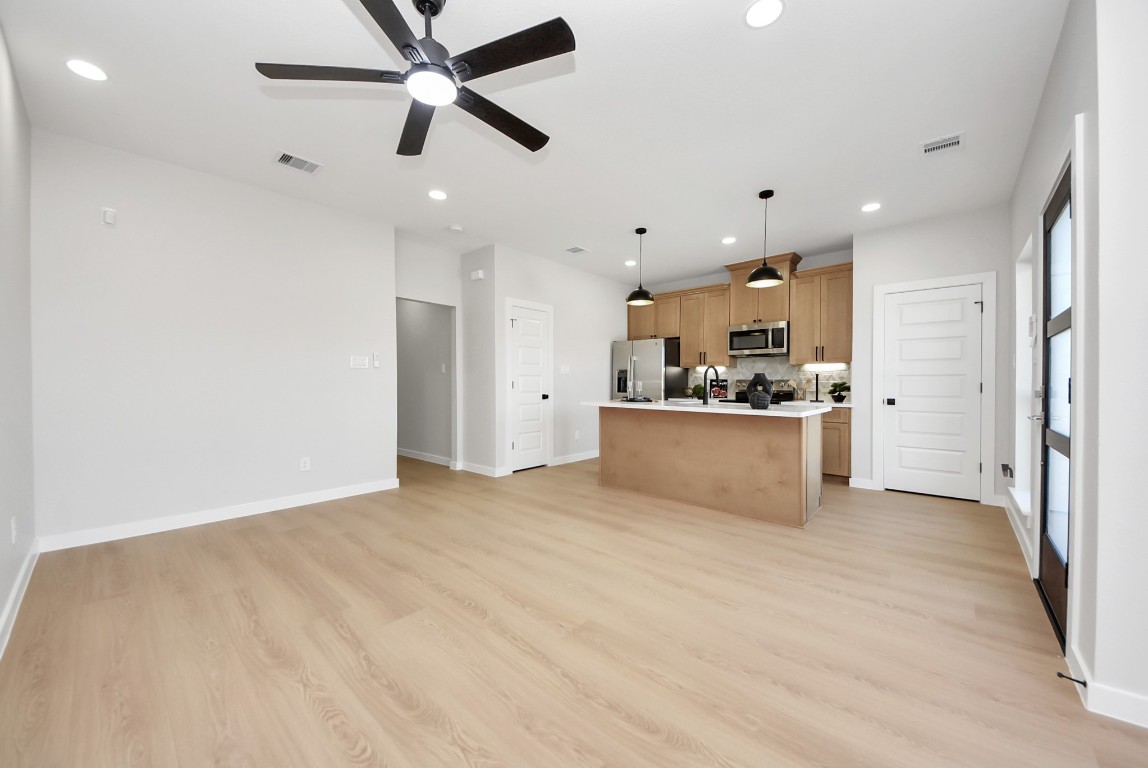9826 Nedwald Street Houston, TX 77029 - Photo 12 of 50 a view of a kitchen with a sink and a refrigerator