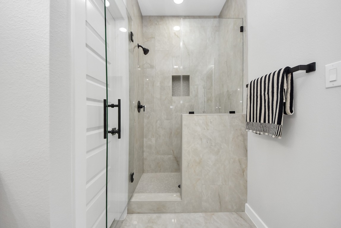 9826 Nedwald Street Houston, TX 77029 - Photo 19 of 50 a bathroom with a shower and a sink