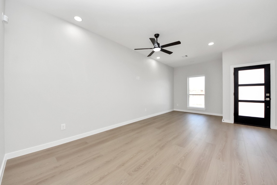 9826 Nedwald Street Houston, TX 77029 - Photo 24 of 50 wooden floor in an empty room with a window