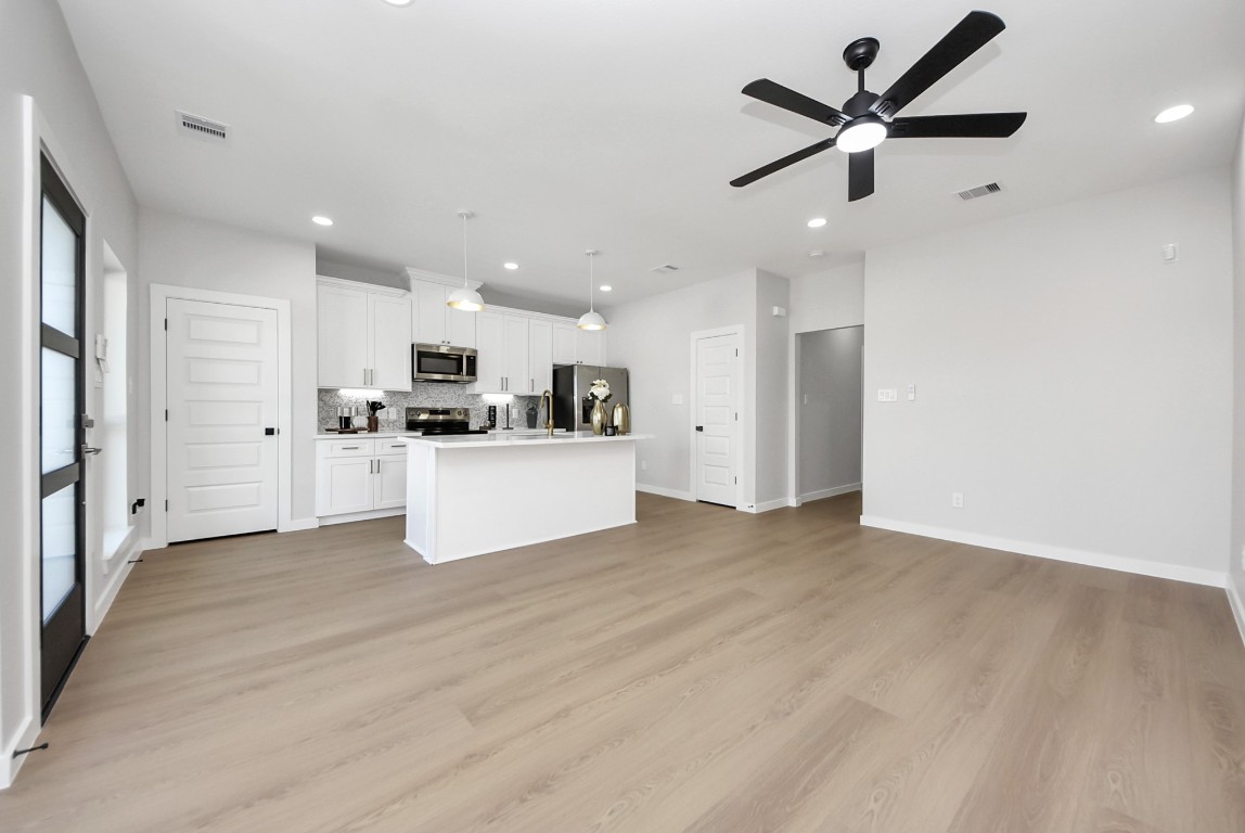 9826 Nedwald Street Houston, TX 77029 - Photo 26 of 50 a view of a kitchen with a sink stainless steel appliances and cabinets