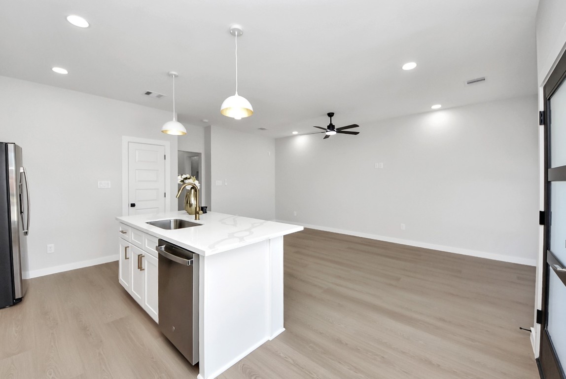9826 Nedwald Street Houston, TX 77029 - Photo 31 of 50 a kitchen that has a lot of cabinets in it