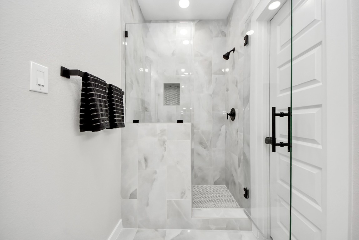 9826 Nedwald Street Houston, TX 77029 - Photo 41 of 50 a bathroom with a shower and a sink