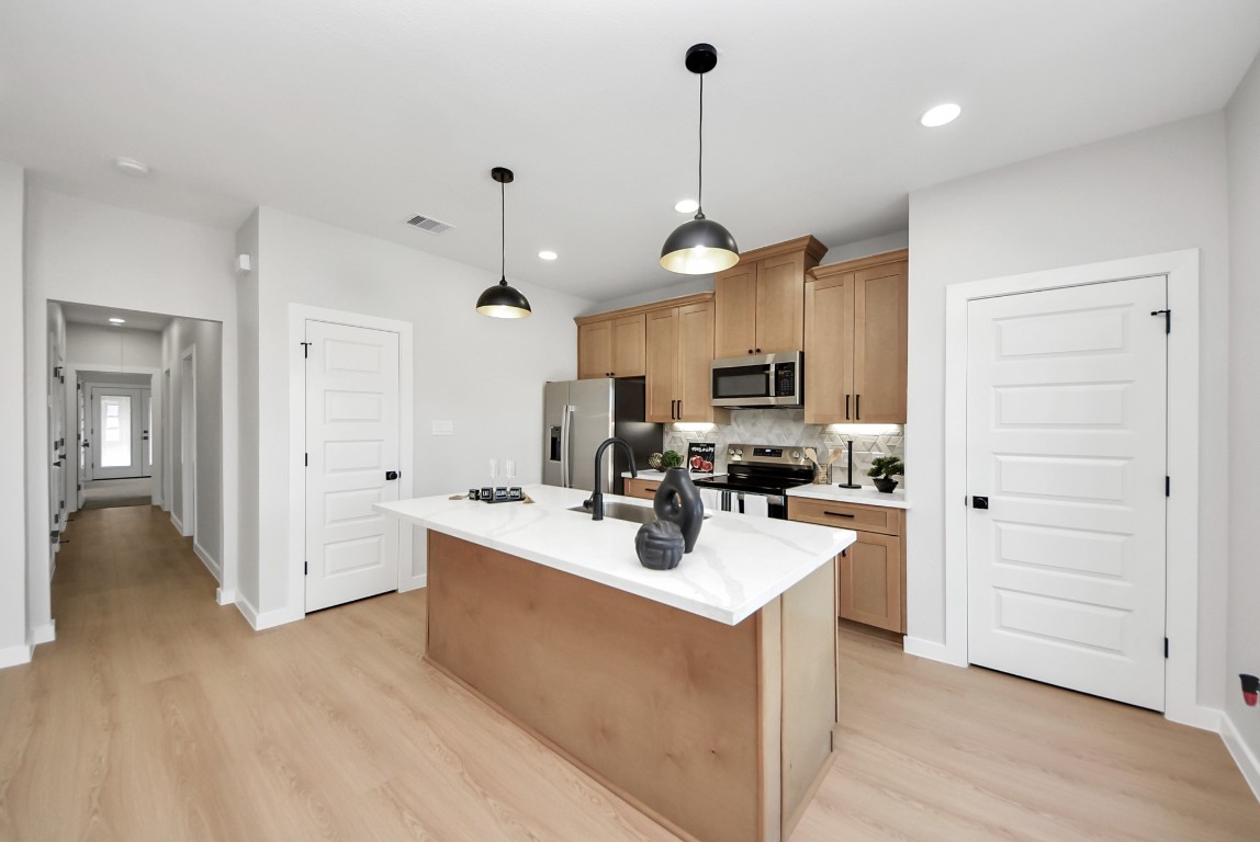 9826 Nedwald Street Houston, TX 77029 - Photo 8 of 50 a view of a kitchen and kitchen island