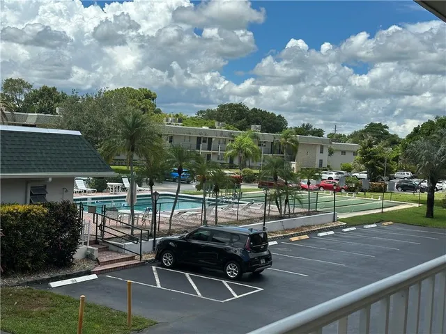 a view of a dining room with furniture and a large window
