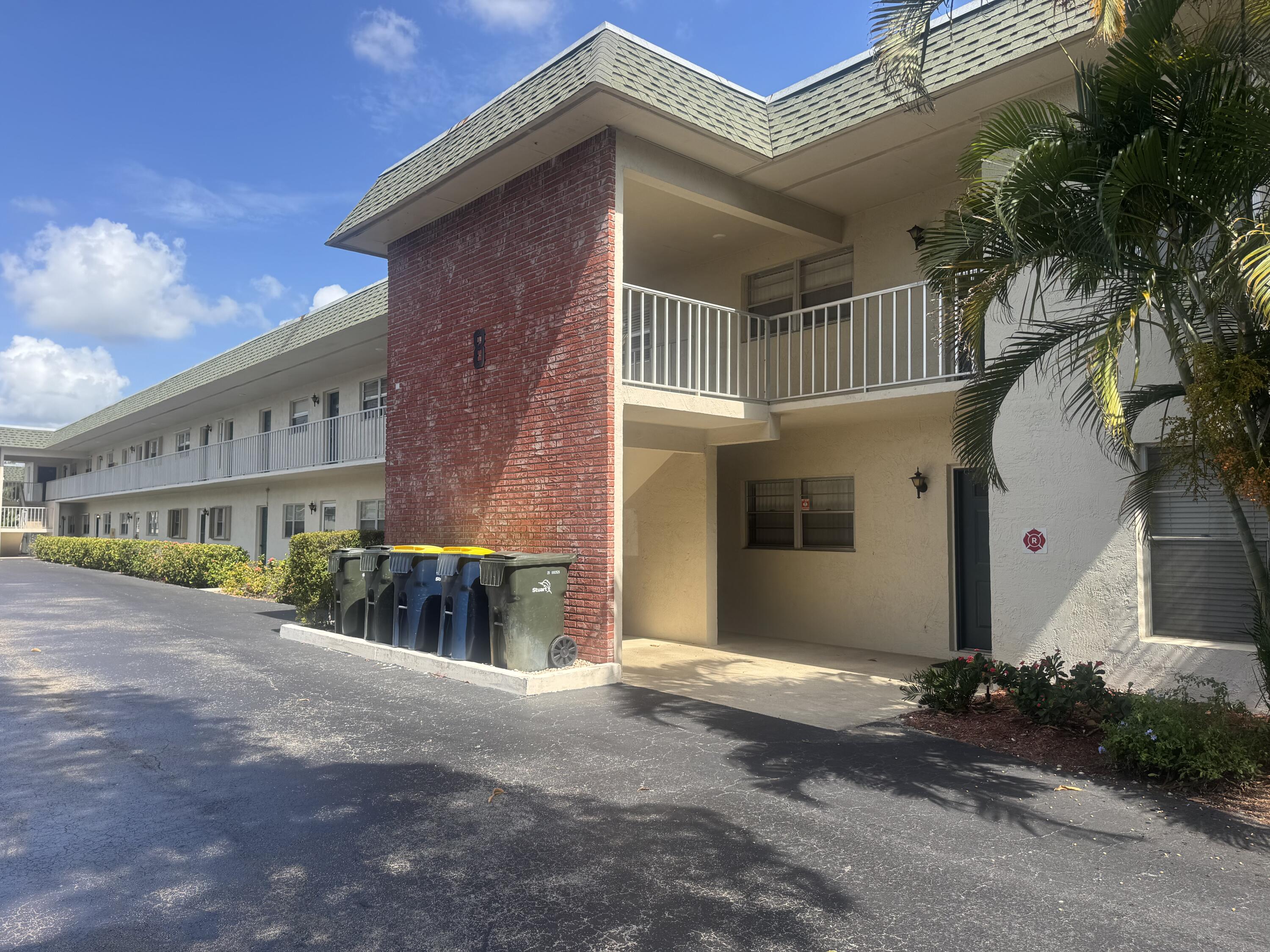 1900 South Kanner Highway, Unit 8205 Stuart, FL 34994 - Photo 2 of 20 a front view of a house with a yard