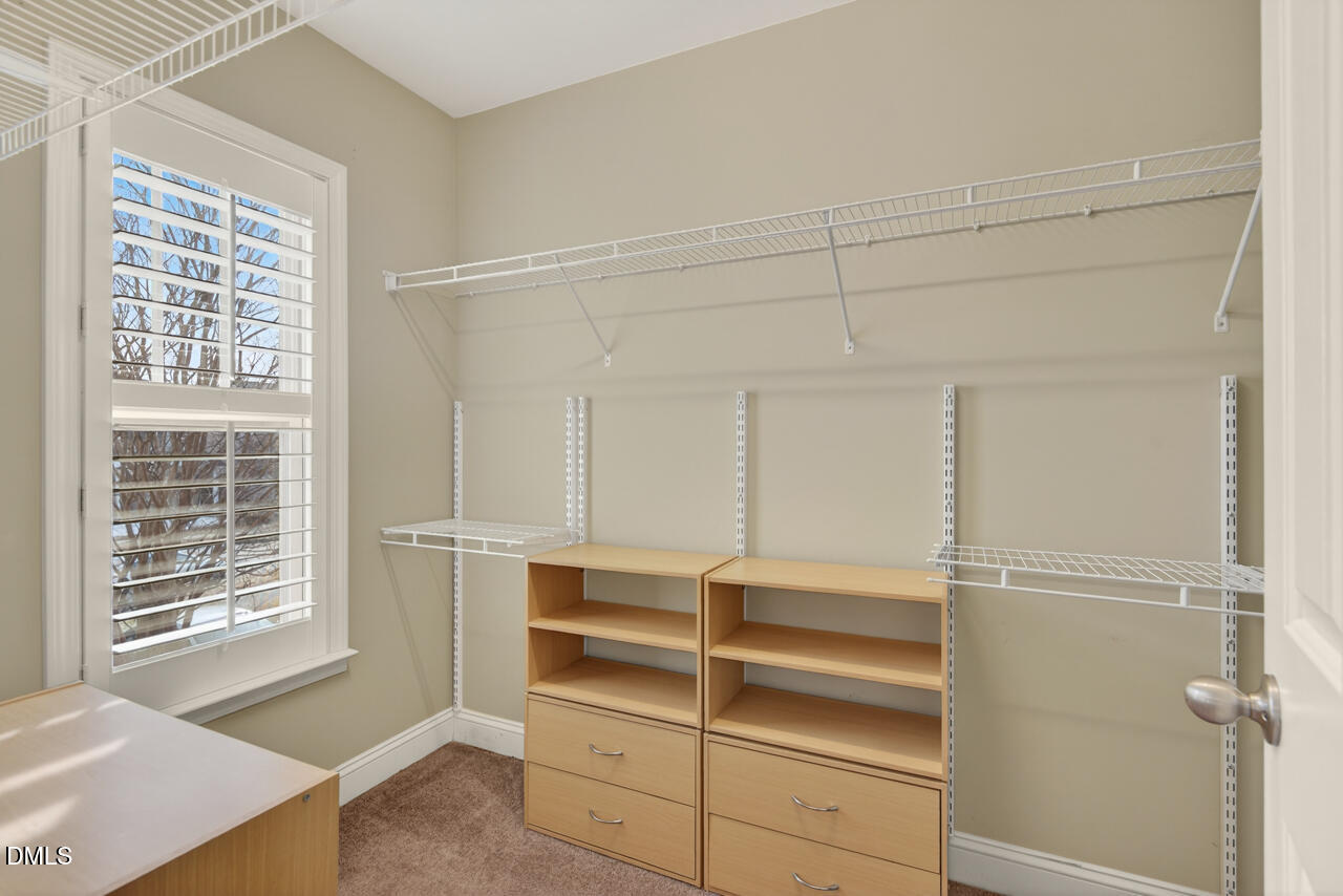 548 Abbey Fields Loop Morrisville, NC 27560 - Photo 18 of 29 a view of an empty walk in closet