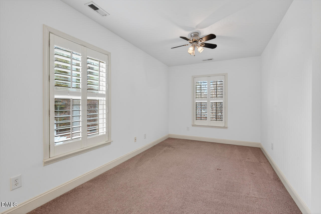 548 Abbey Fields Loop Morrisville, NC 27560 - Photo 22 of 29 a view of an empty room with a window