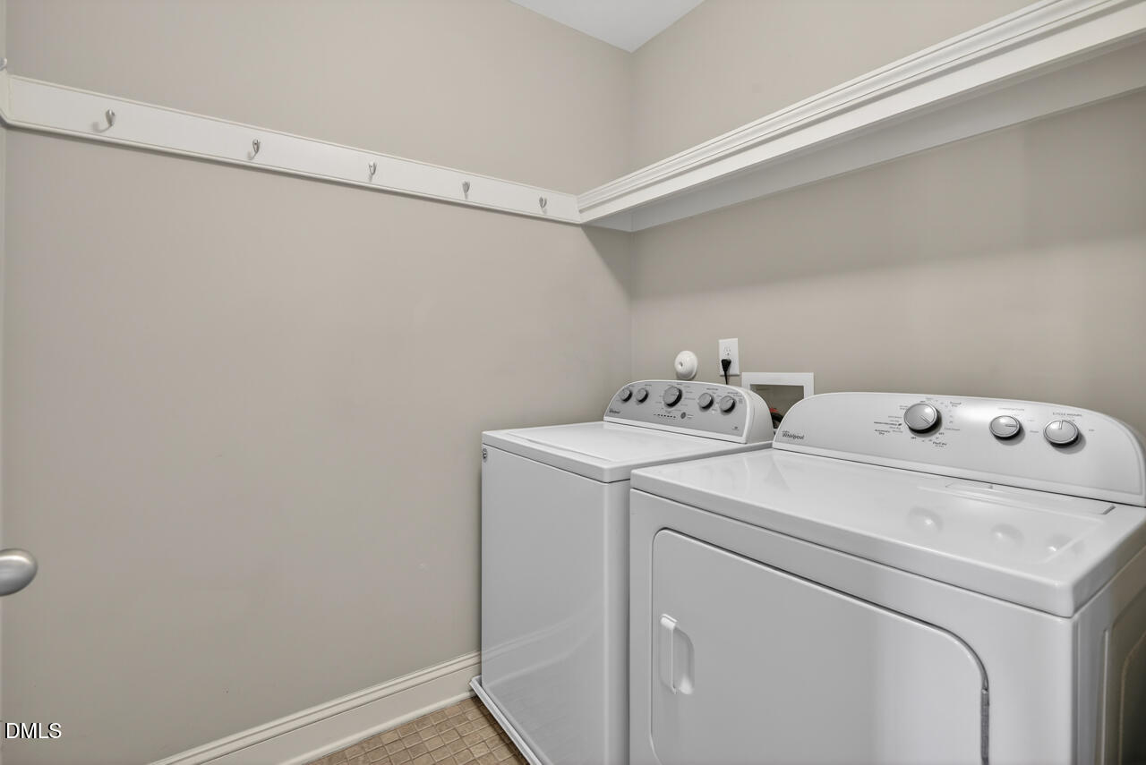 548 Abbey Fields Loop Morrisville, NC 27560 - Photo 24 of 29 a utility room with dryer and washer