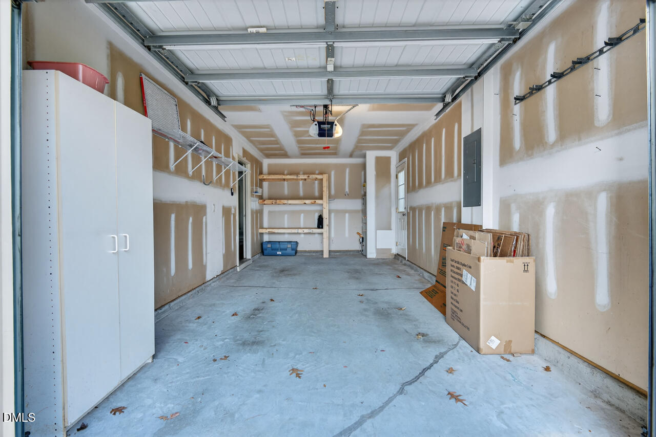 548 Abbey Fields Loop Morrisville, NC 27560 - Photo 25 of 29 a view of a hallway with washer and dryer
