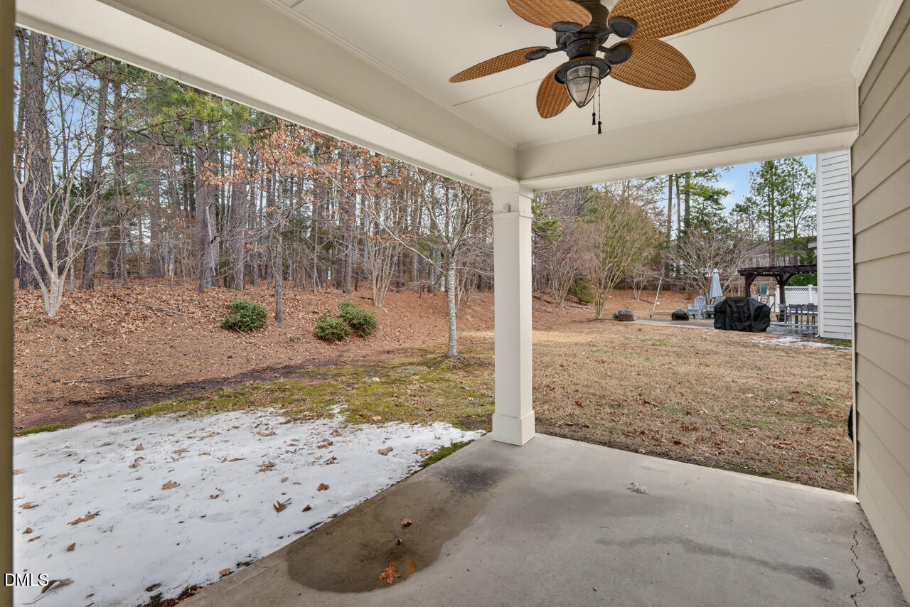 548 Abbey Fields Loop Morrisville, NC 27560 - Photo 26 of 29 a view of a porch with a backyard