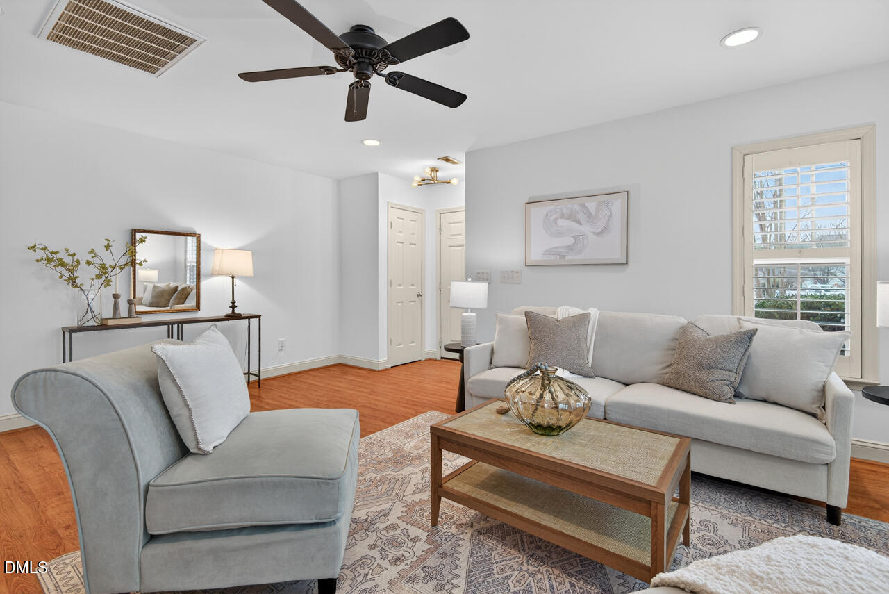 548 Abbey Fields Loop Morrisville, NC 27560 - Photo 6 of 29 a living room with furniture and a window
