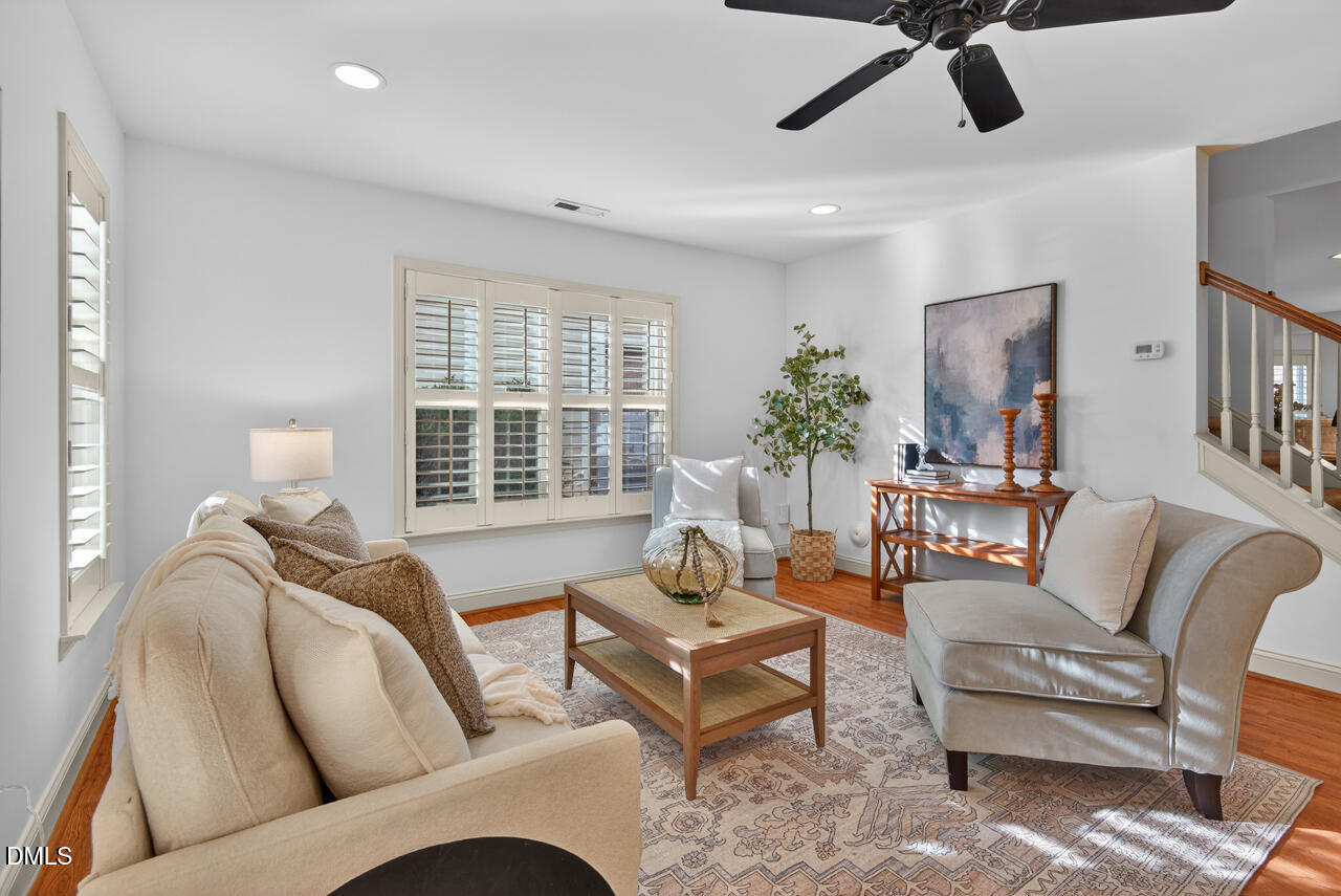 548 Abbey Fields Loop Morrisville, NC 27560 - Photo 7 of 29 a living room with furniture and a large window