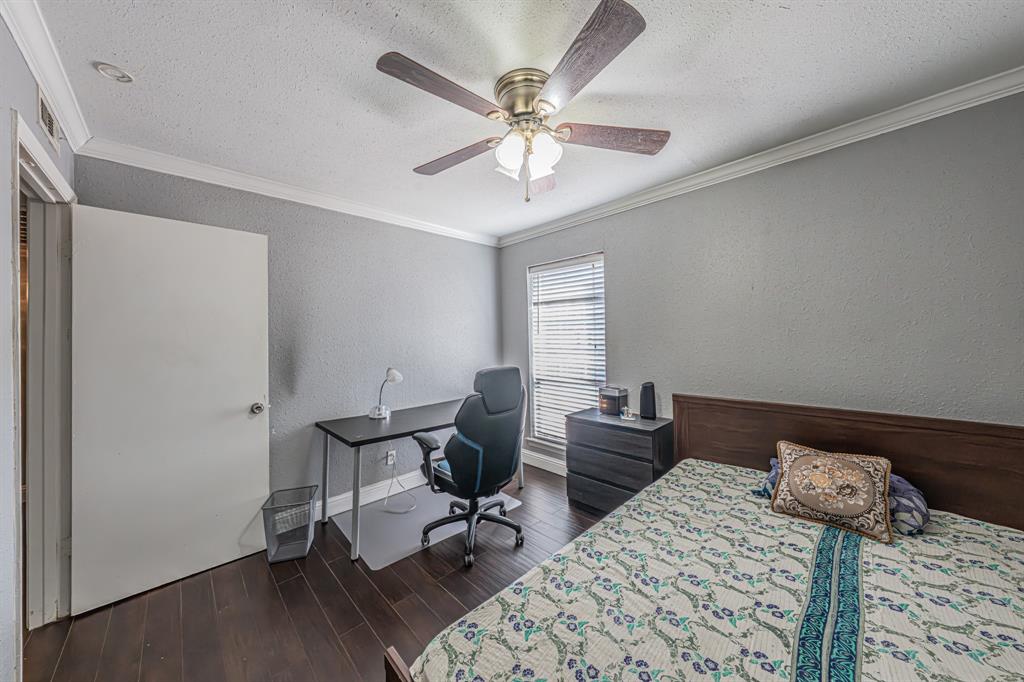 1807 East Grauwyler Road, Unit 124 Irving, TX 75061 - Photo 15 of 22 a view of a workspace with furniture and a ceiling fan