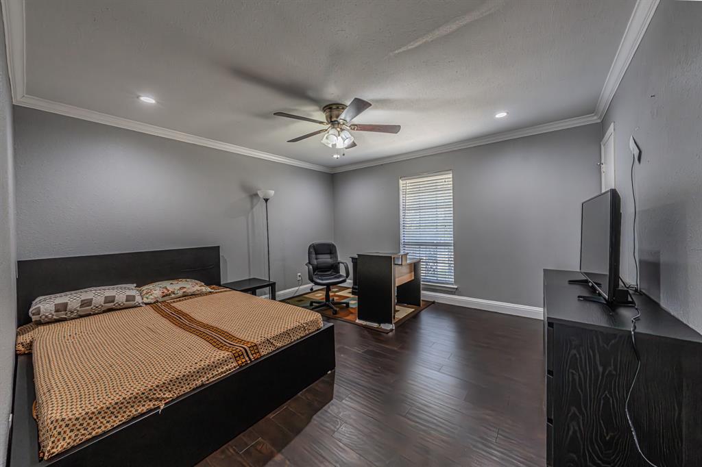 1807 East Grauwyler Road, Unit 124 Irving, TX 75061 - Photo 16 of 22 a bed room with a bed and furniture