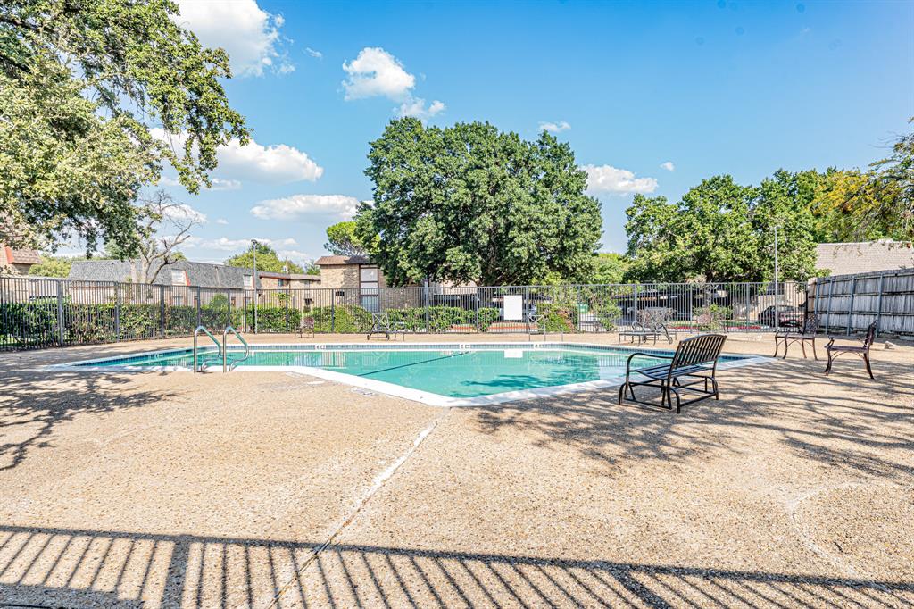 1807 East Grauwyler Road, Unit 124 Irving, TX 75061 - Photo 3 of 22 a view of a swimming pool and a yard