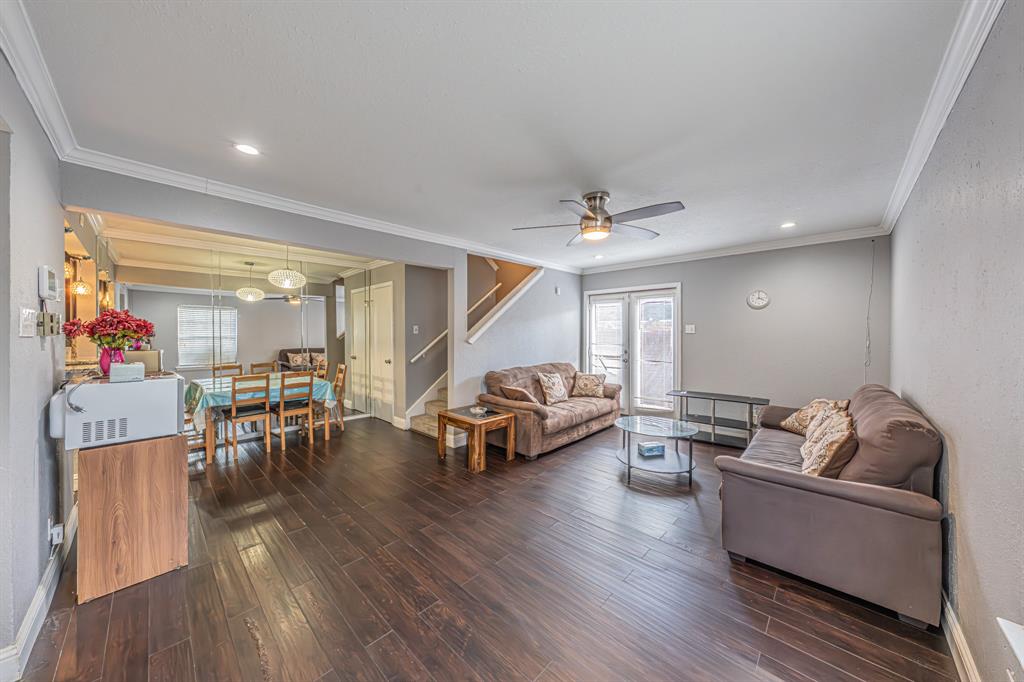 1807 East Grauwyler Road, Unit 124 Irving, TX 75061 - Photo 4 of 22 a living room with furniture and a wooden floor