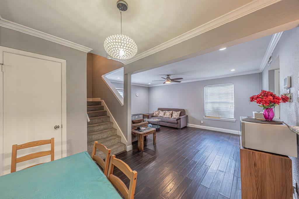 1807 East Grauwyler Road, Unit 124 Irving, TX 75061 - Photo 5 of 22 a view of a livingroom with furniture wooden floor and a ceiling fan