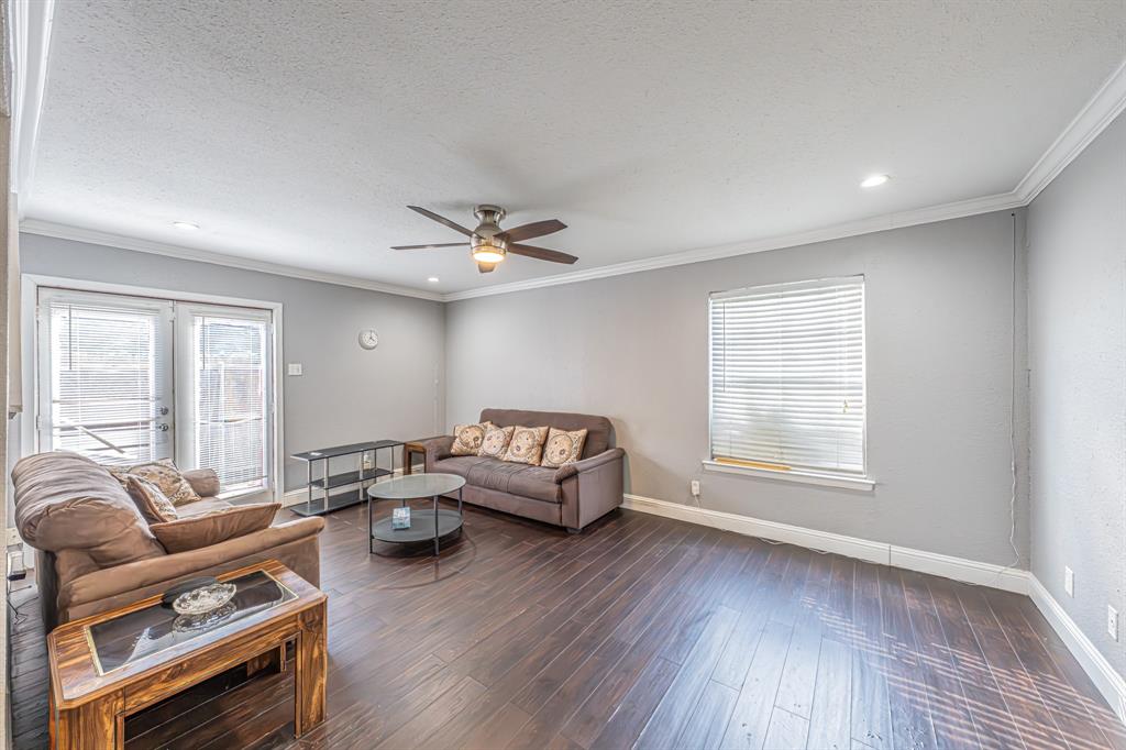 1807 East Grauwyler Road, Unit 124 Irving, TX 75061 - Photo 6 of 22 a living room with furniture and wooden floor