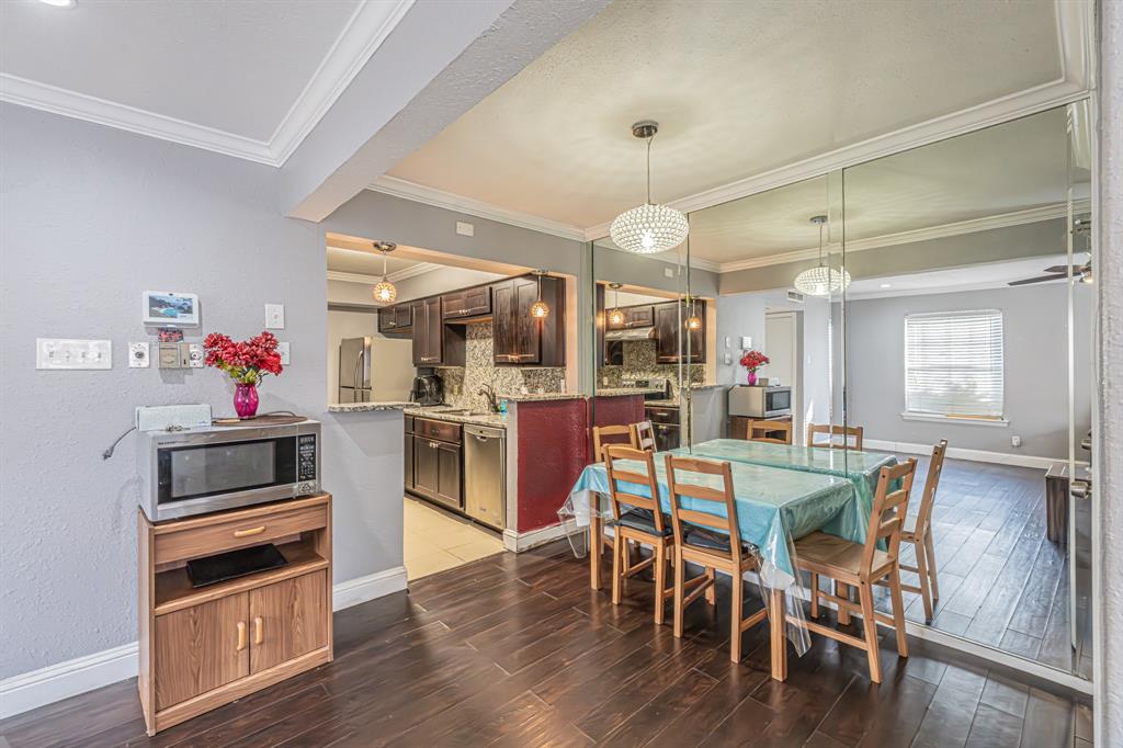 1807 East Grauwyler Road, Unit 124 Irving, TX 75061 - Photo 9 of 22 a view of a dining room with furniture and wooden floor