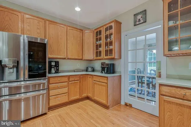 a kitchen with stainless steel appliances granite countertop a stove and a refrigerator