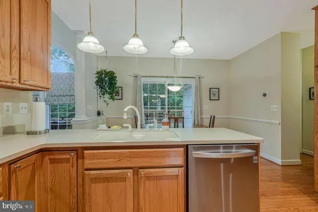 a kitchen with a sink and a granite counter top