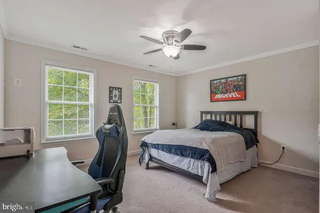 a bedroom with a bed and a table