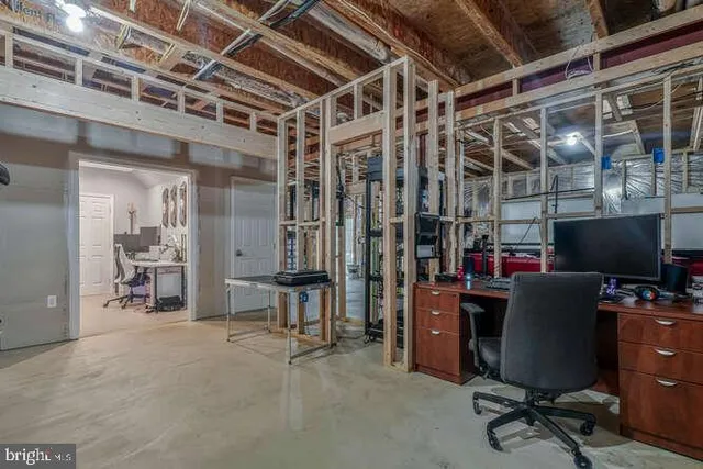 a view of a workspace with furniture