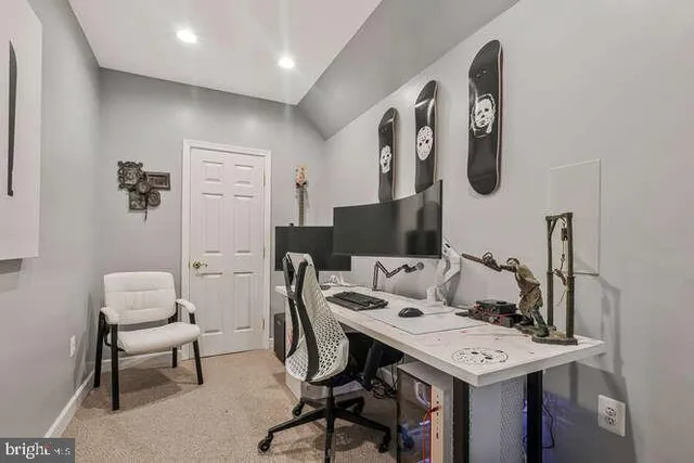 a view of a workspace with furniture