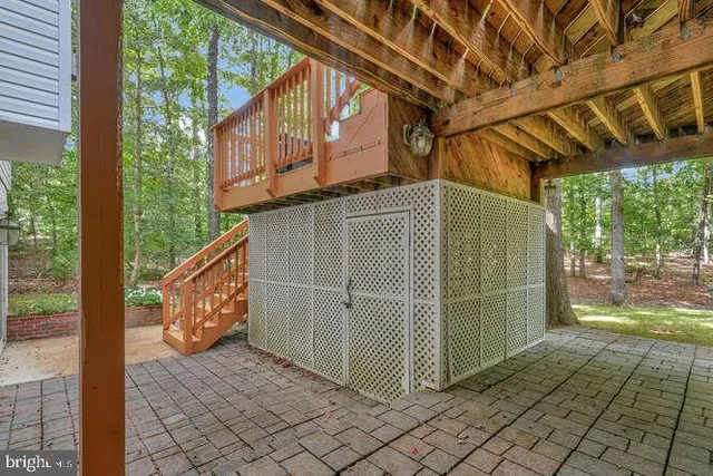 a swimming pool with outdoor seating and yard