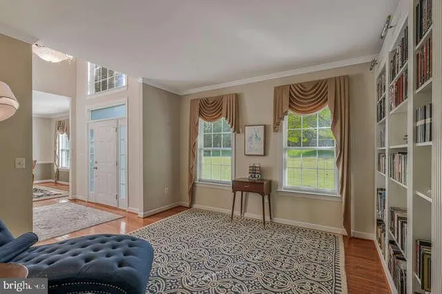 a bedroom with a bed and a window with the outer view
