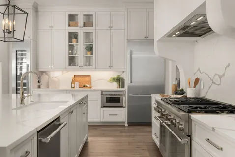 a kitchen with stainless steel appliances granite countertop a stove and a sink