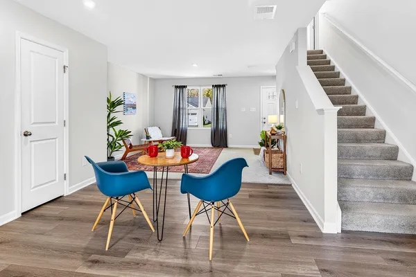 a living room with furniture and a rug