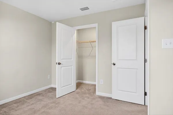 a bathroom with a sink a toilet and shower curtain