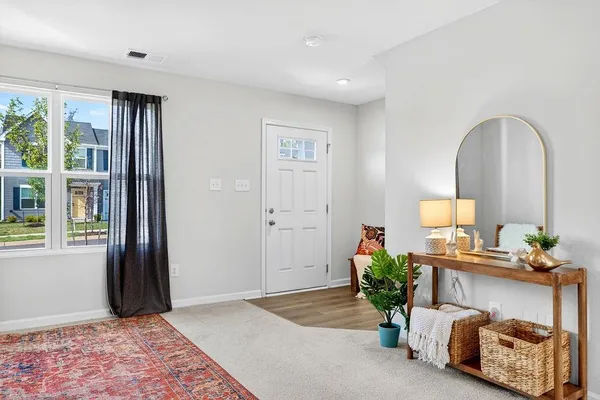 a living room with furniture and a rug