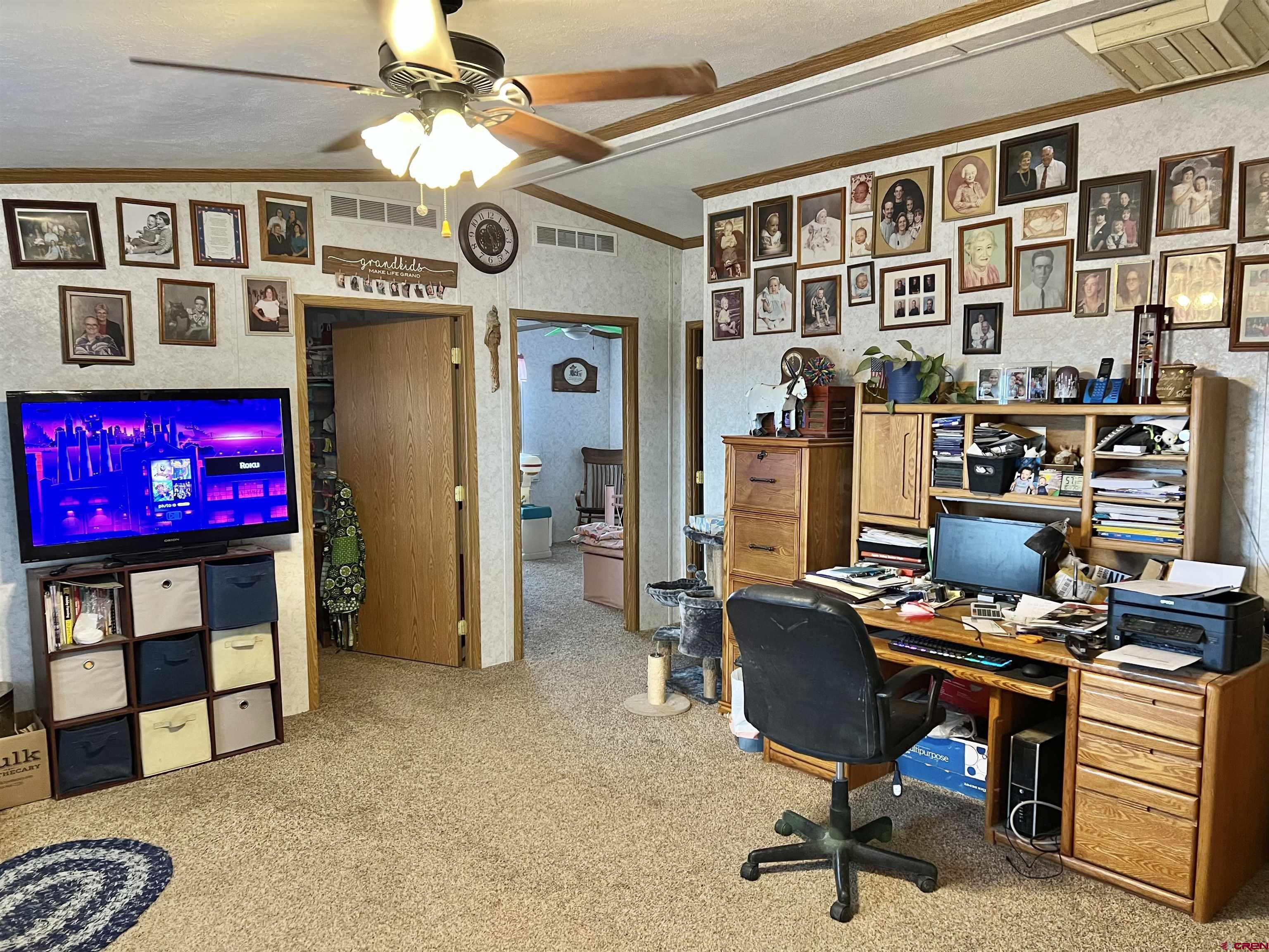 7692 6150th Road Montrose, CO 81401 - Photo 5 of 17 a view of a livingroom with workspace and a window