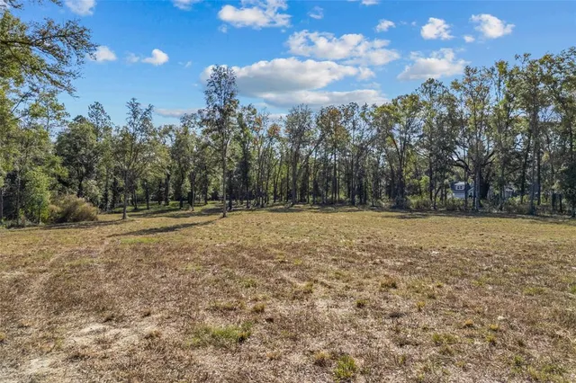 a view of outdoor space with deck and yard