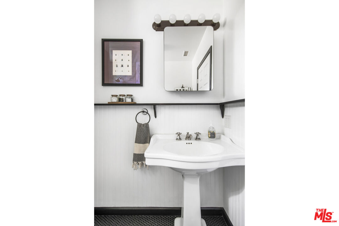 2035 Summit Avenue Pasadena, CA 91103 - Photo 17 of 27 a bathroom with a sink and a mirror