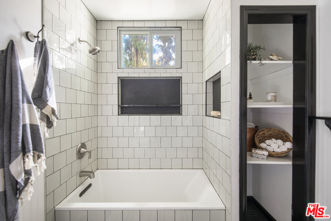 2035 Summit Avenue Pasadena, CA 91103 - Photo 18 of 27 a bathroom with a bathtub and shower