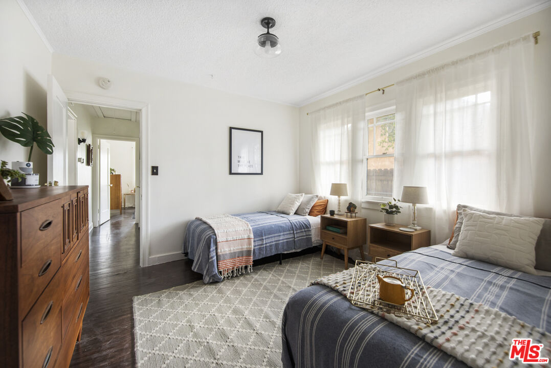 2035 Summit Avenue Pasadena, CA 91103 - Photo 19 of 27 a bedroom with a bed couch and a window