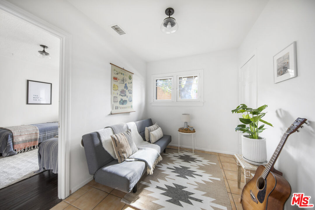 2035 Summit Avenue Pasadena, CA 91103 - Photo 21 of 27 a living room with furniture flowerpot and a chandelier