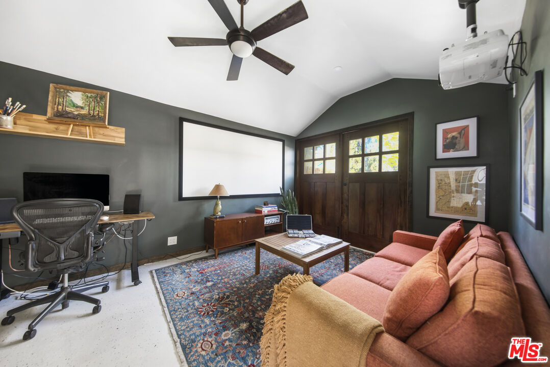 2035 Summit Avenue Pasadena, CA 91103 - Photo 24 of 27 a living room with furniture and a fireplace