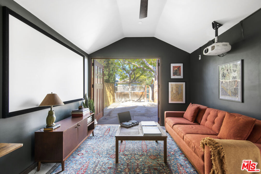 2035 Summit Avenue Pasadena, CA 91103 - Photo 25 of 27 a living room with furniture and a large window