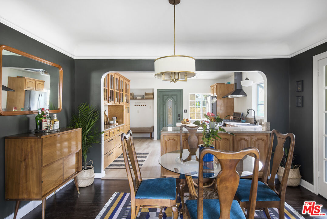 2035 Summit Avenue Pasadena, CA 91103 - Photo 7 of 27 a view of a dining room with furniture window and wooden floor