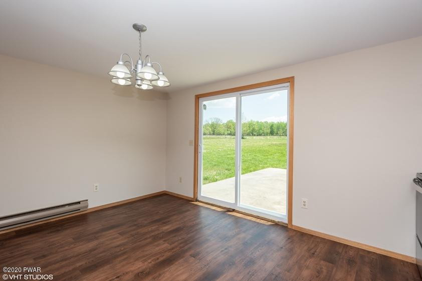 110 Boulder Road Lake Ariel, PA 18436 - Photo 7 of 18 a view of an empty room with wooden floor and a window