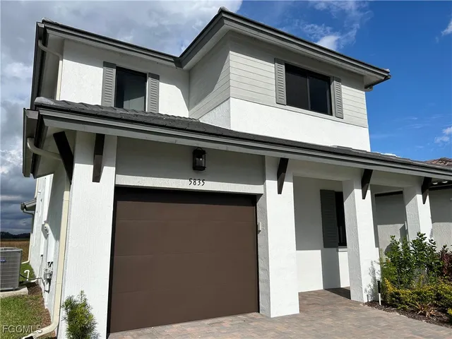 a house with a window and balcony